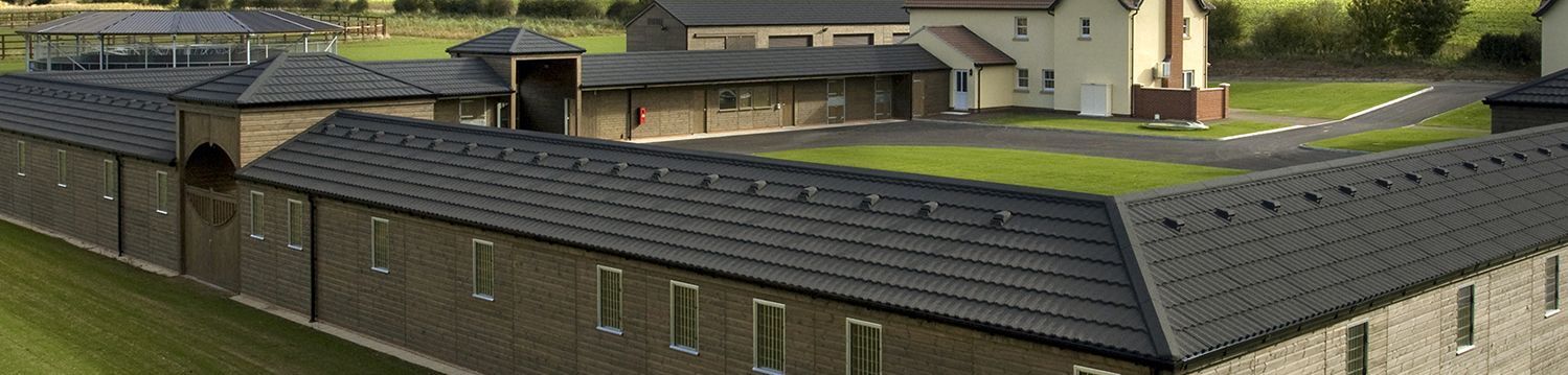 Harling wood equestrian centre with metrotile bond in charcoal