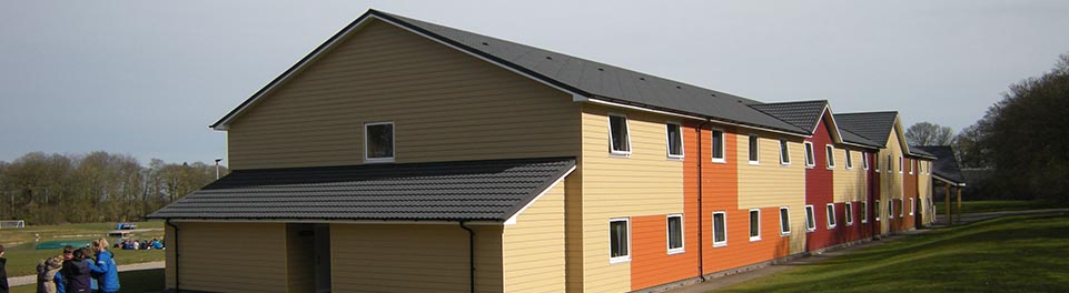 PGL Liddington Timber Frame Accommodation with Metrotile Lightweight Roofing in Bond Charcoal with retrofit Photovoltaic System