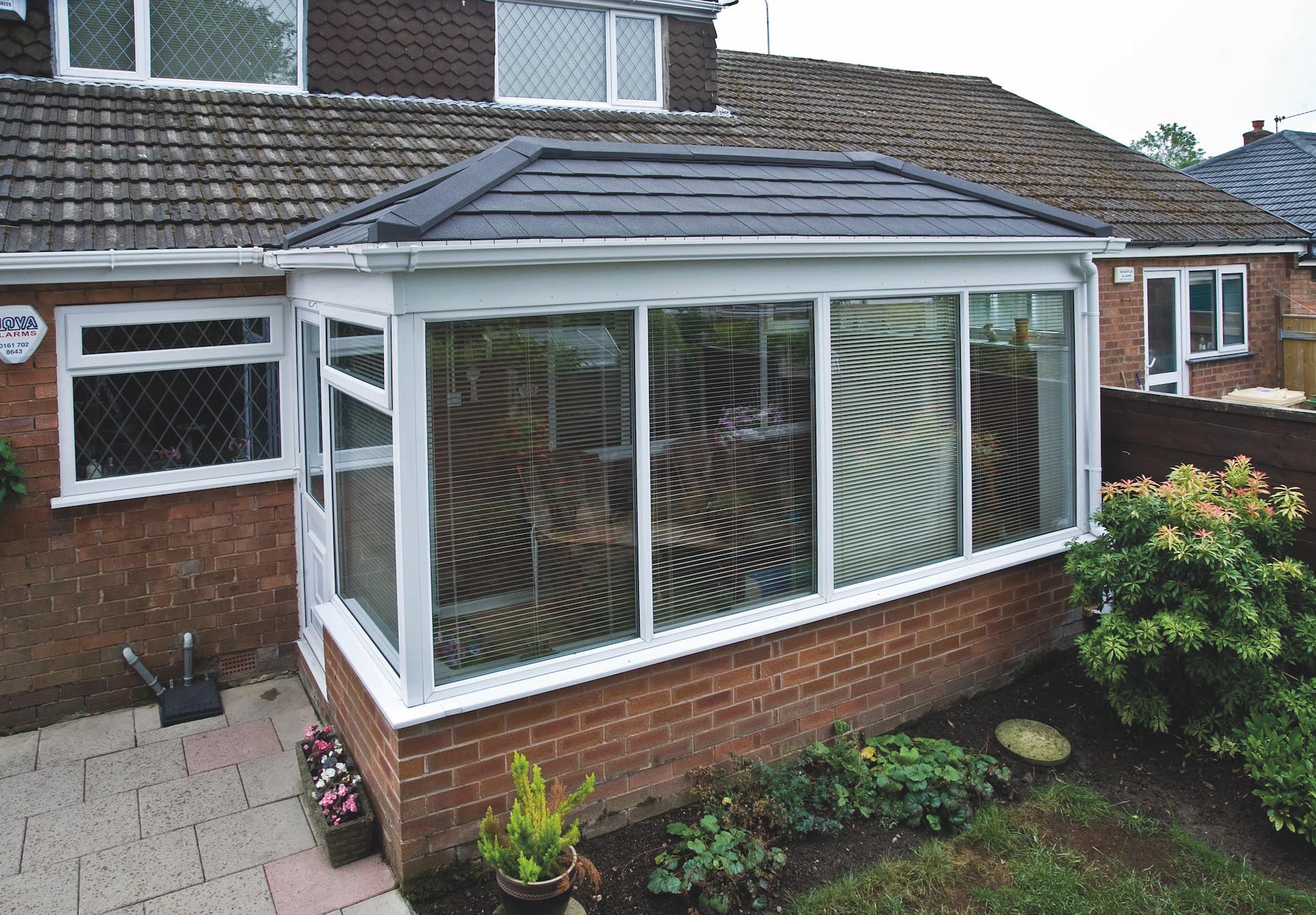 Conservatory refurbished with a Metrotile Lightweight Roof System Shingle Charcoal