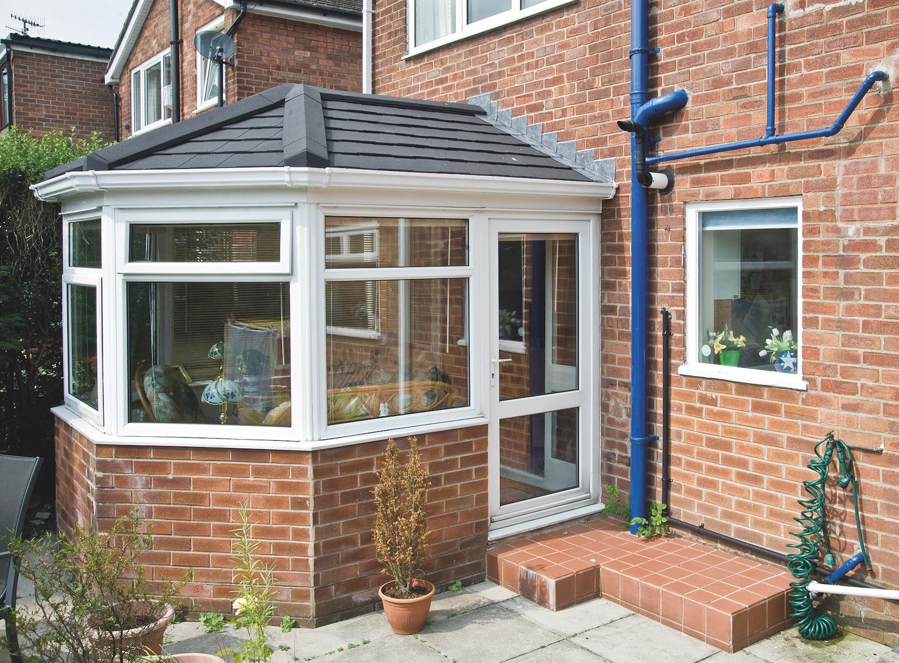 Conservatory refurbished with a Metrotile Lightweight Roof System Shingle Charcoal
