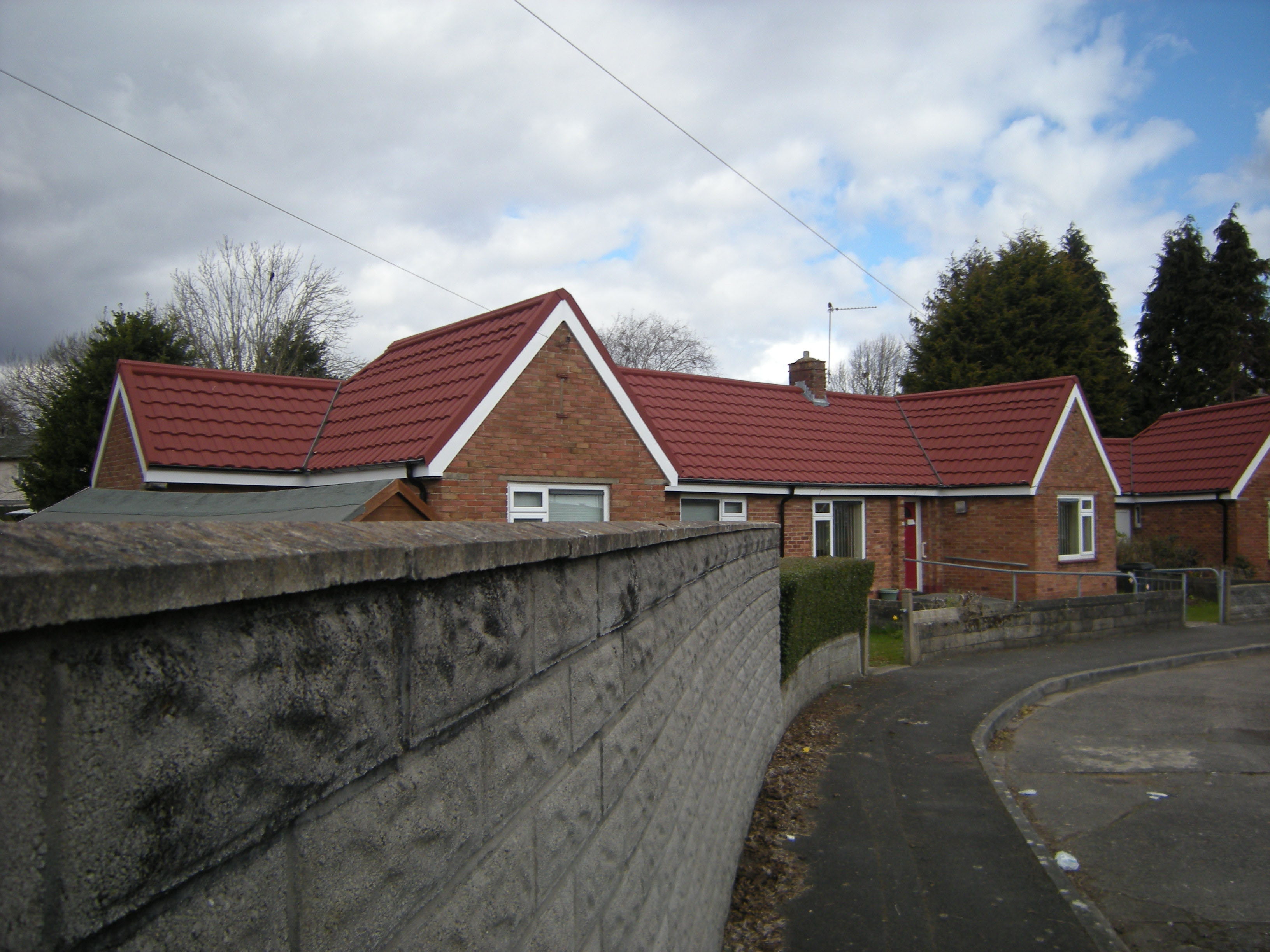 Red Brick Homes in Cardiff Refurbished with Metrotile Lightweight Roofing in Roman Red