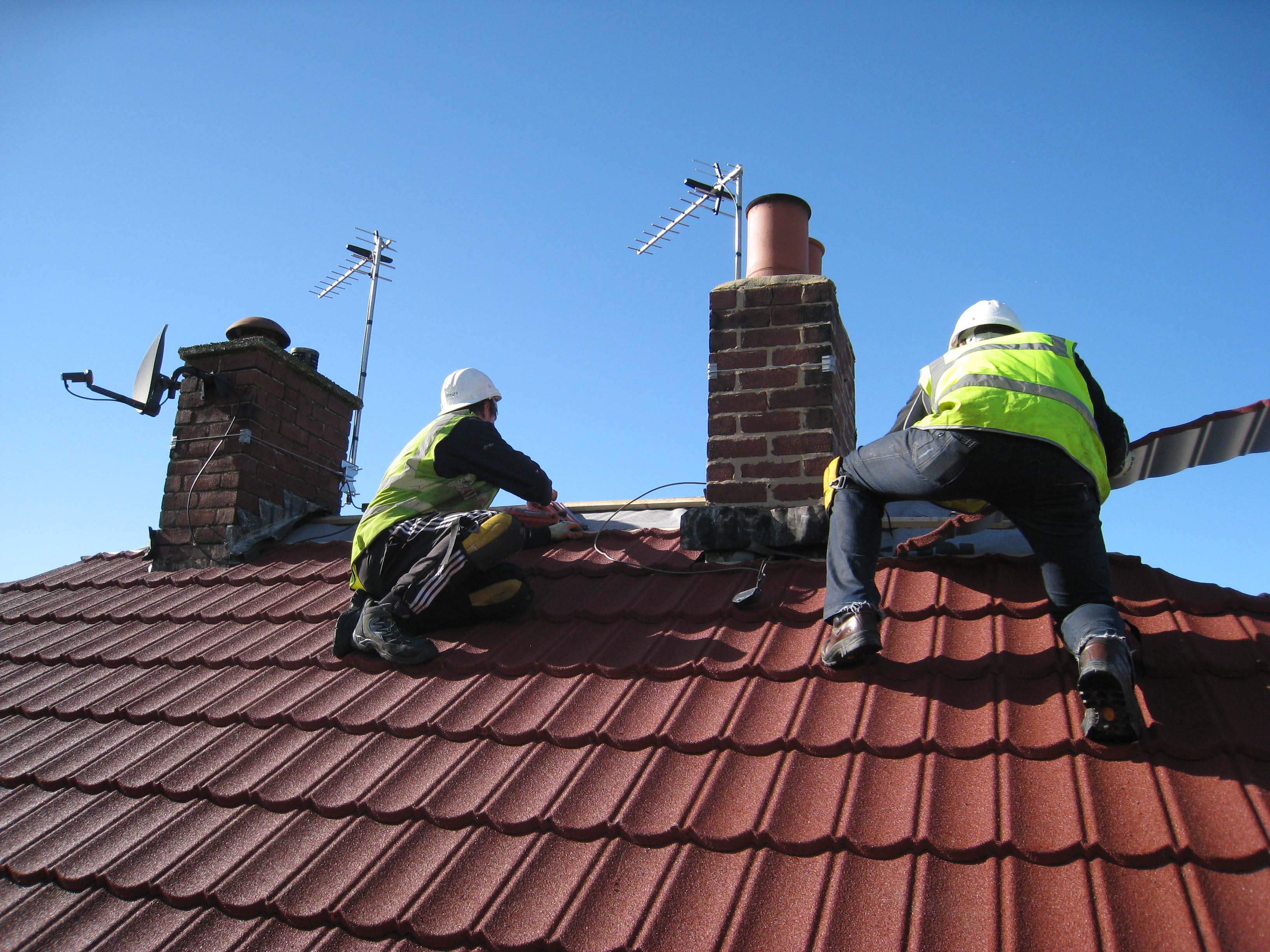 Local Authority Cornish Unit Roof and Mansard Refurbishments with Metrotile Lightweight Roofing in Bond Red