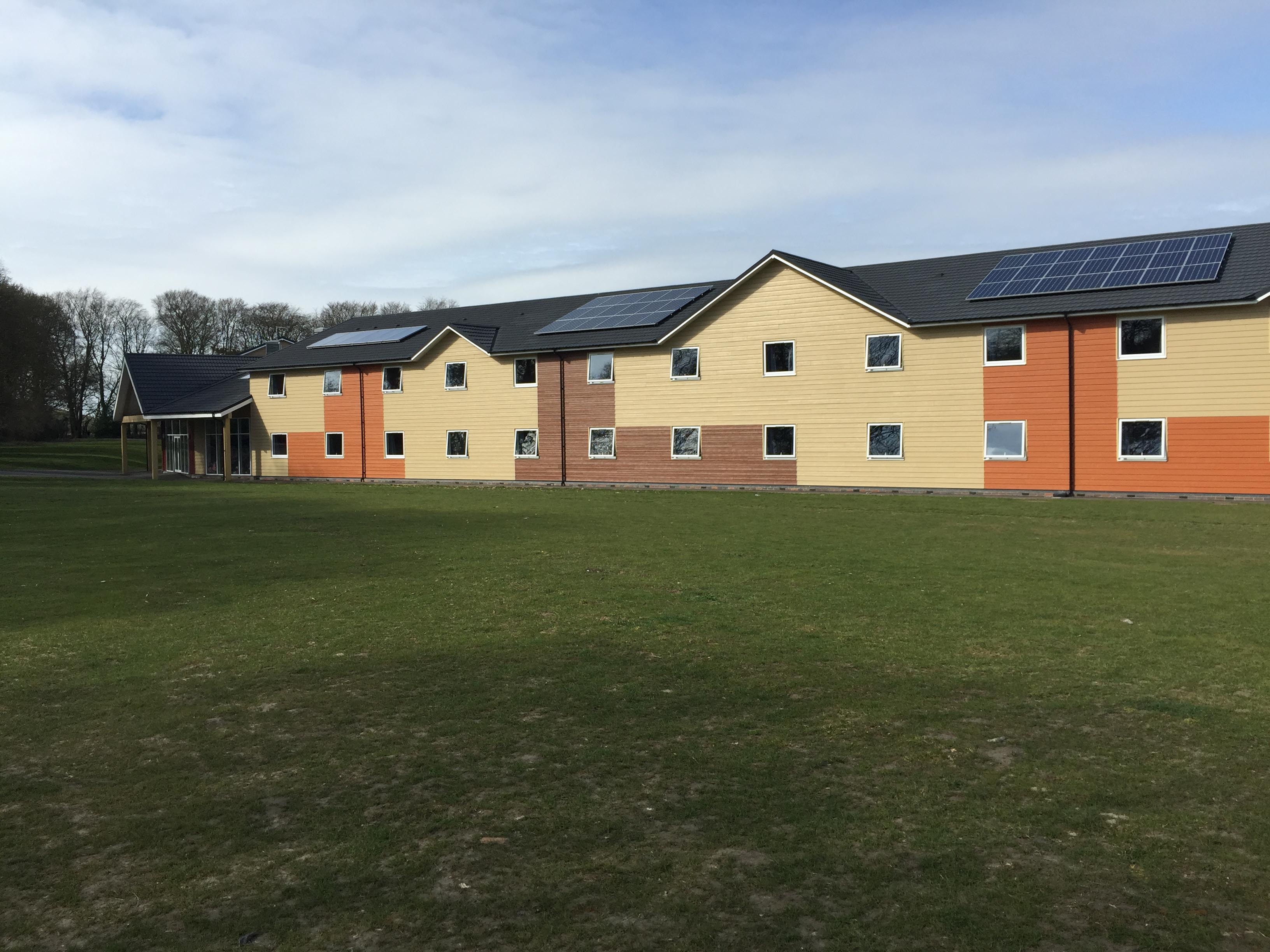 PGL Liddington Timber Frame Accommodation with Metrotile Lightweight Roofing in Bond Charcoal with retrofit Photovoltaic System