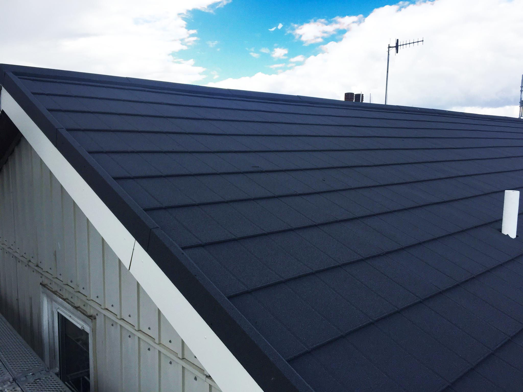 A roof with Metrotile iPanel in Charcoal as the roofing material